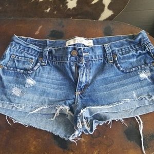 Distressed blue jean shorts